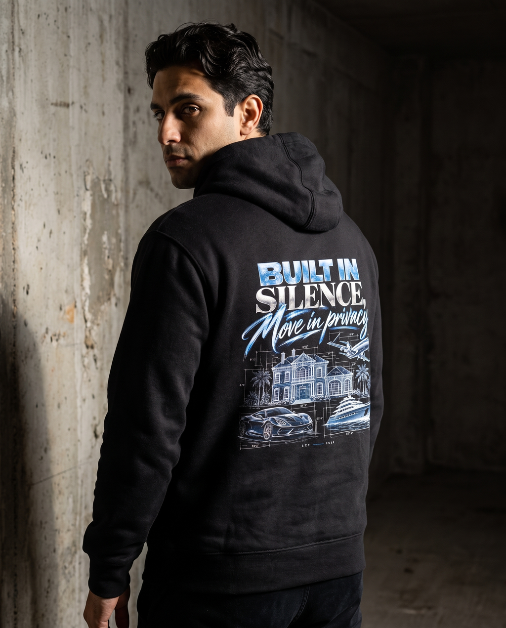 Build In Silence Hoodie in black, back view worn by a male model