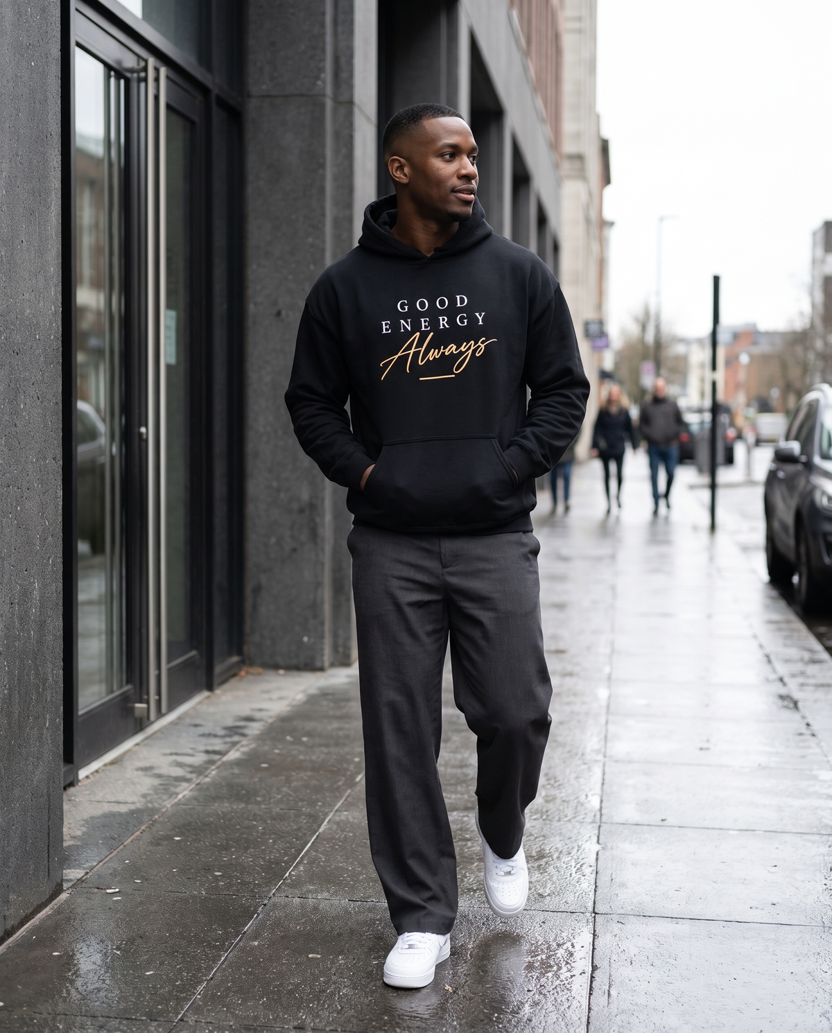 Model wearing the Landells Good Energy Hoodie, street style walking