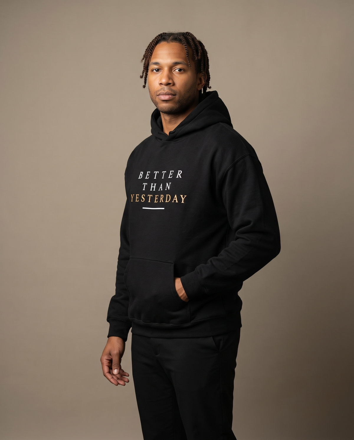 Model wearing the Landells Better Hoodie, studio three-quarter front view