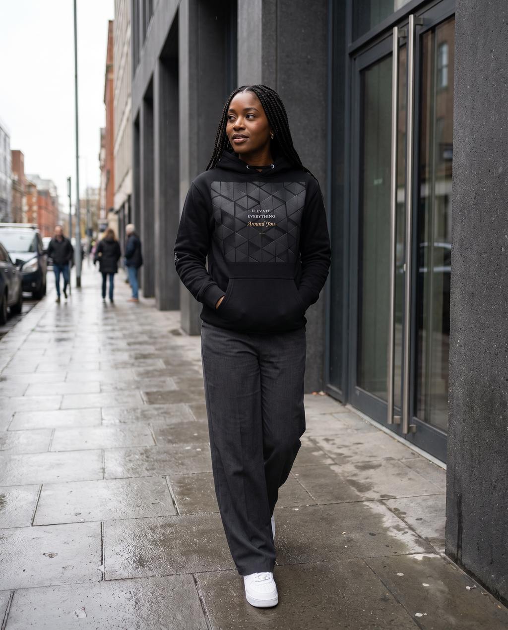 Model wearing the Landells Evaluate Everything Hoodie, street style walking