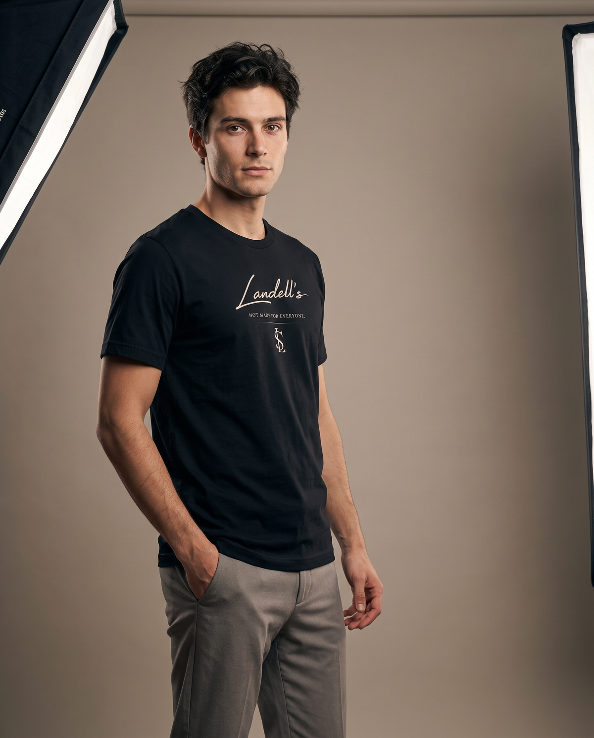 Model wearing the Landells Tee in black, studio three-quarter front view