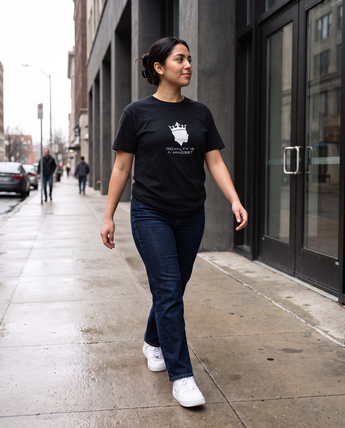 Model wearing the Landells Denim Tee in black, street style walking
