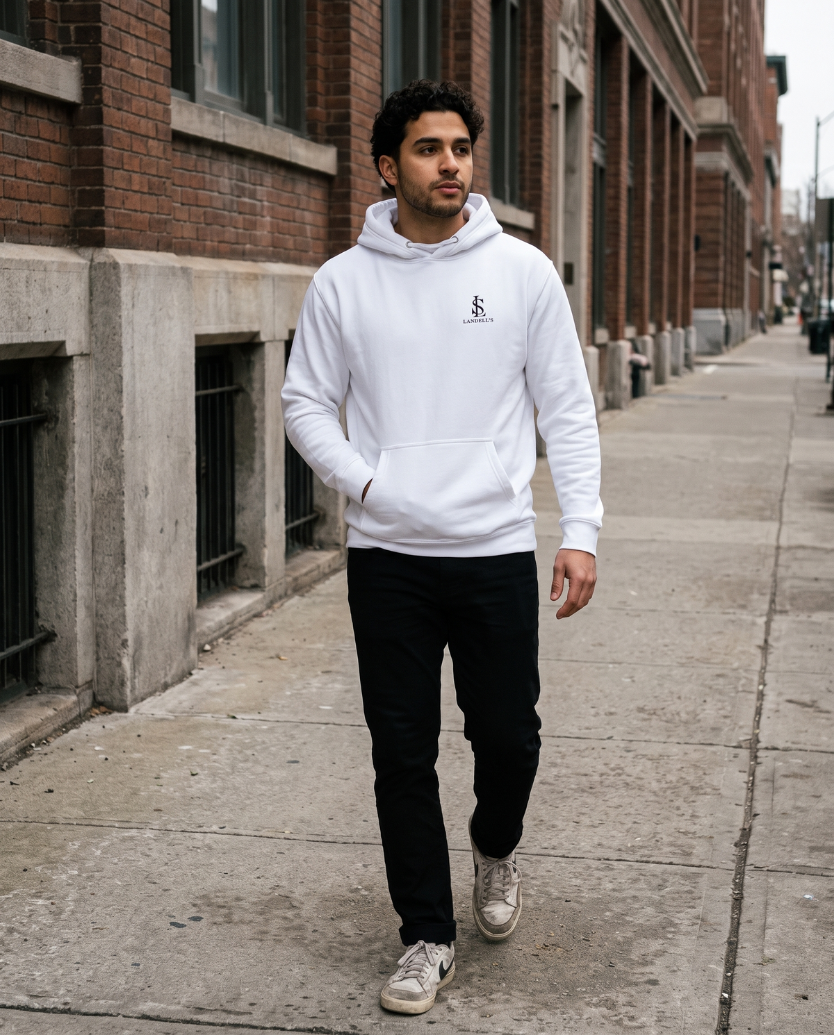 Don't Chase Luxury white hoodie worn walking on a city street