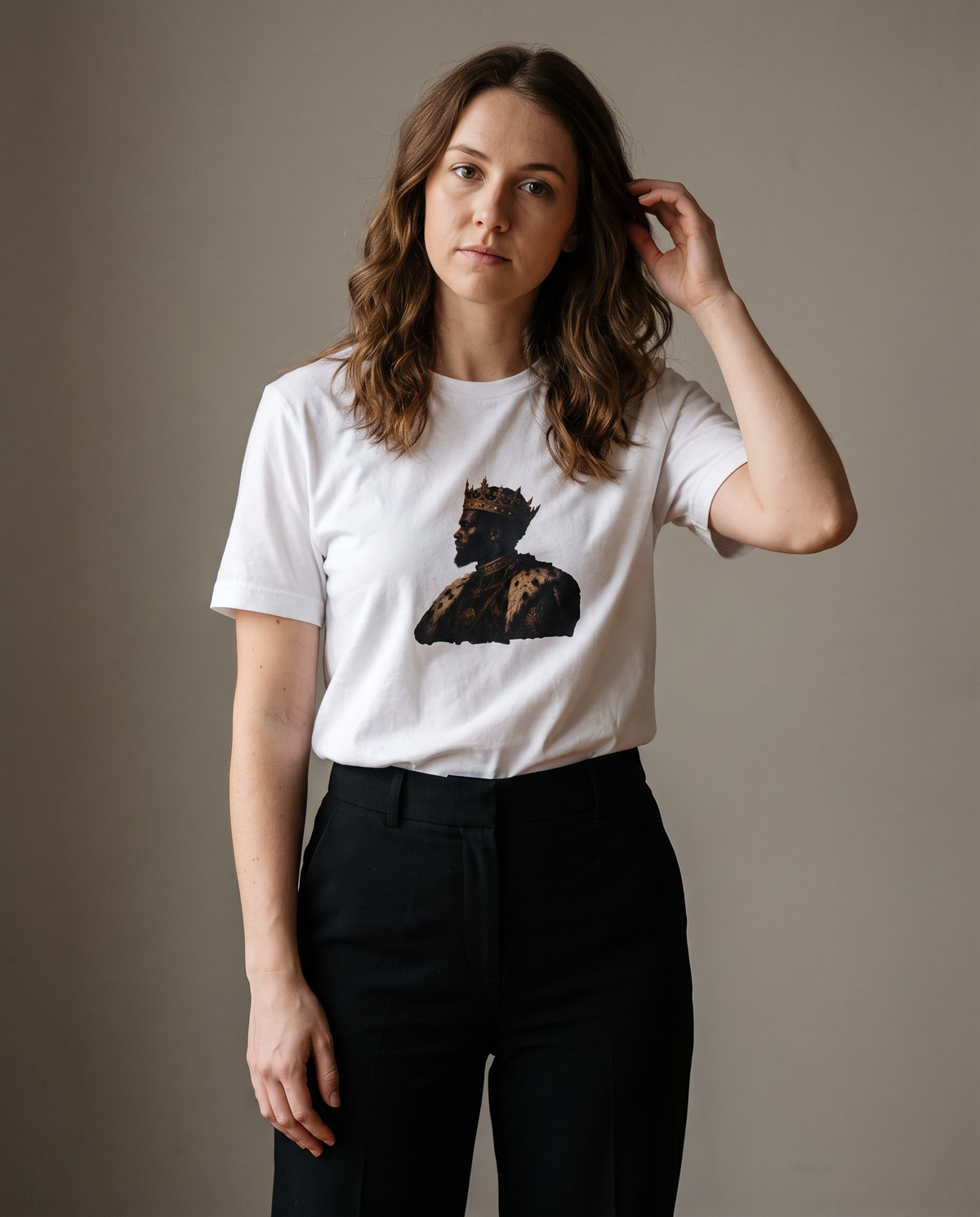 Essential Tee in white worn by a woman, studio view