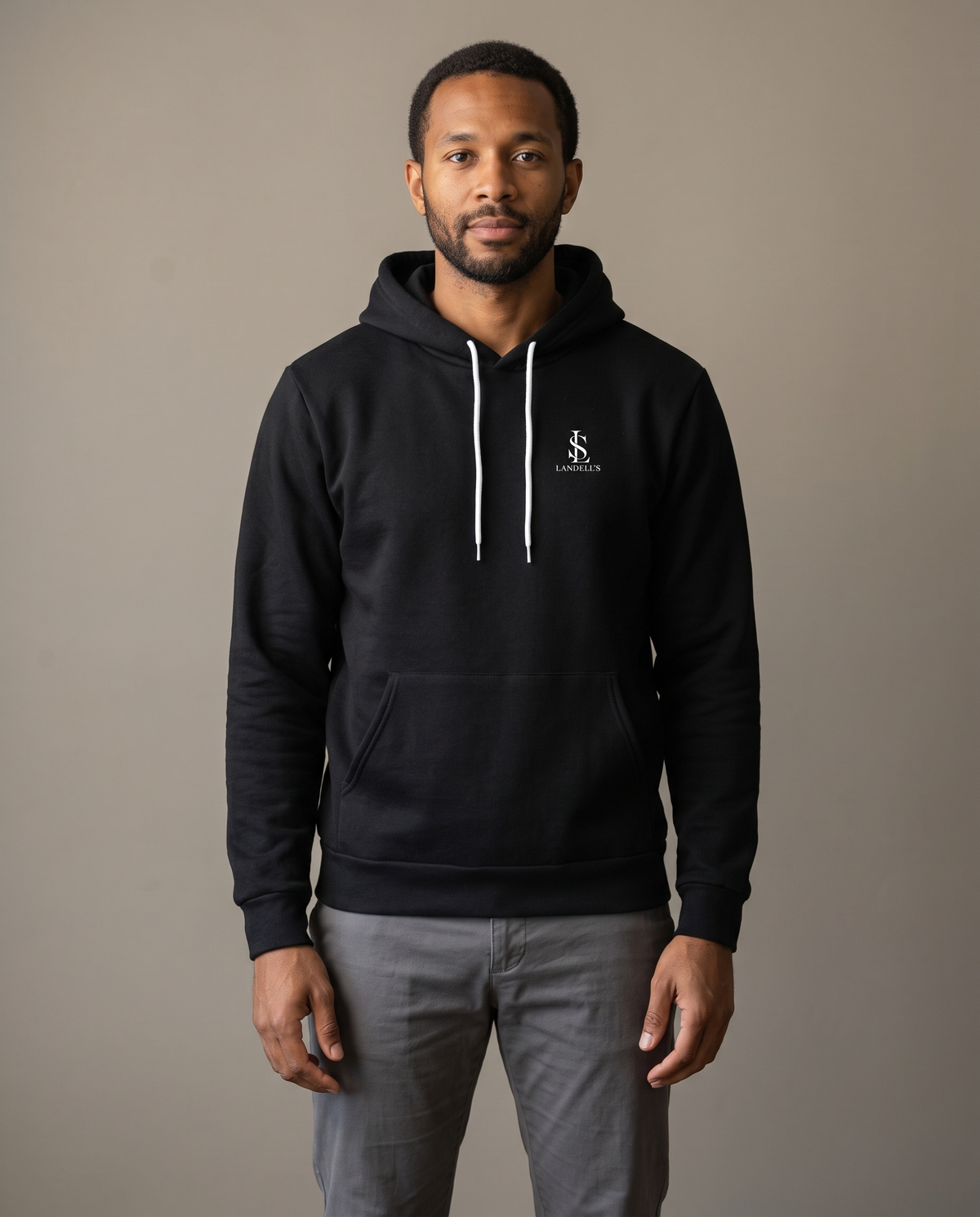 Model wearing the Landells Legacy Hoodie, studio front view
