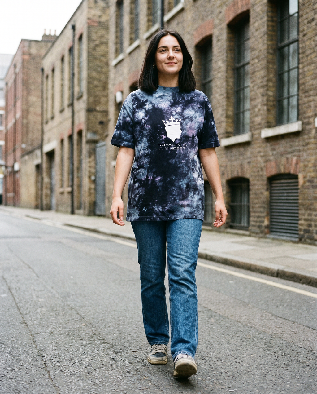 Woman wearing the Royalty Is a Mindset tie-dye tee, street style