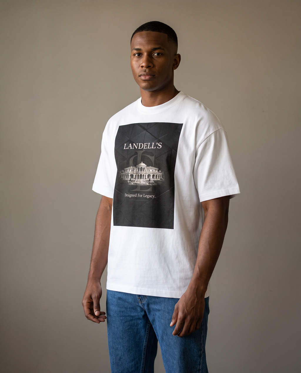 Man wearing the Landells Box Tee with jeans, studio