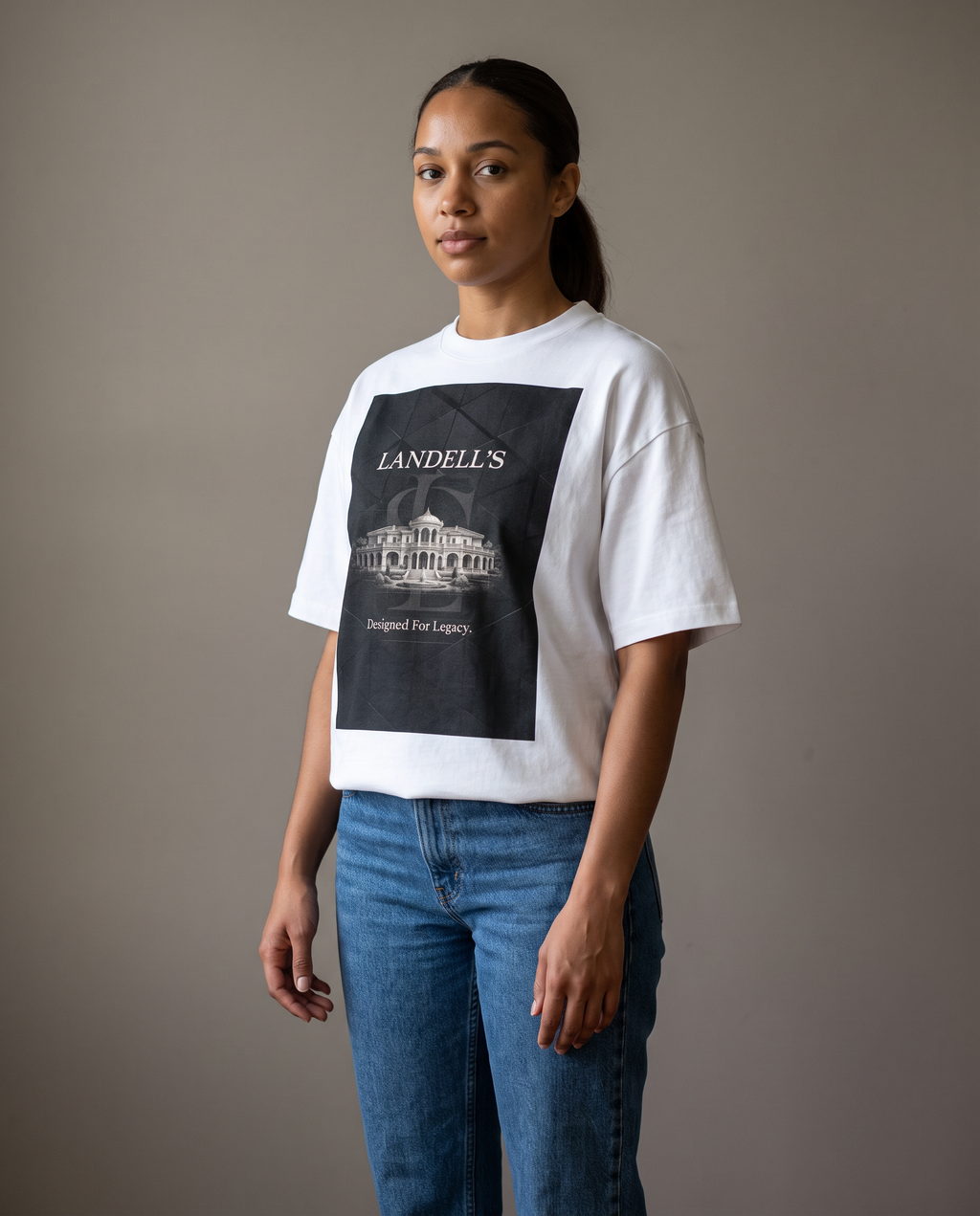 Woman wearing the Landells Box Tee with jeans, studio