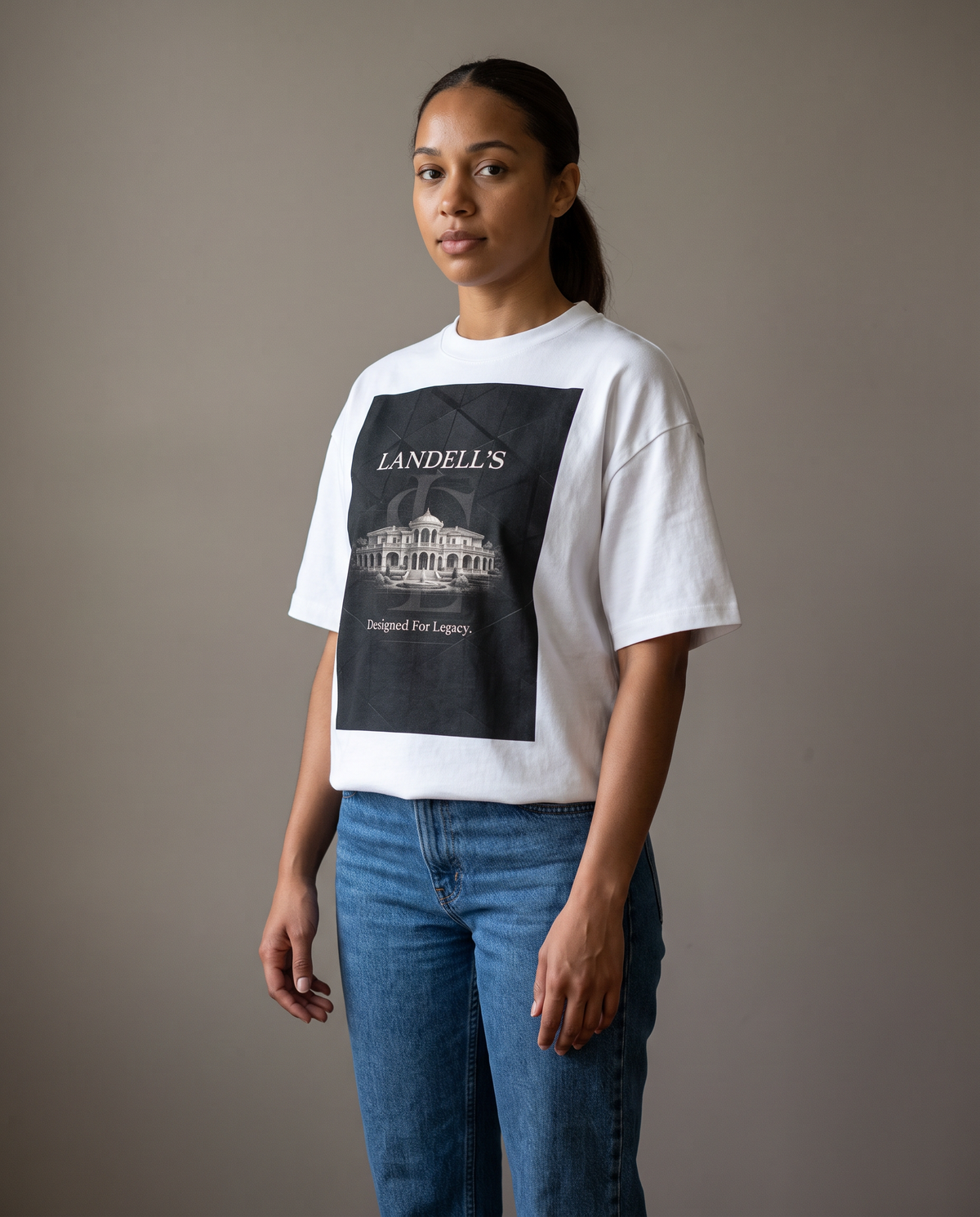 Woman wearing the Landells Box Tee with jeans, studio