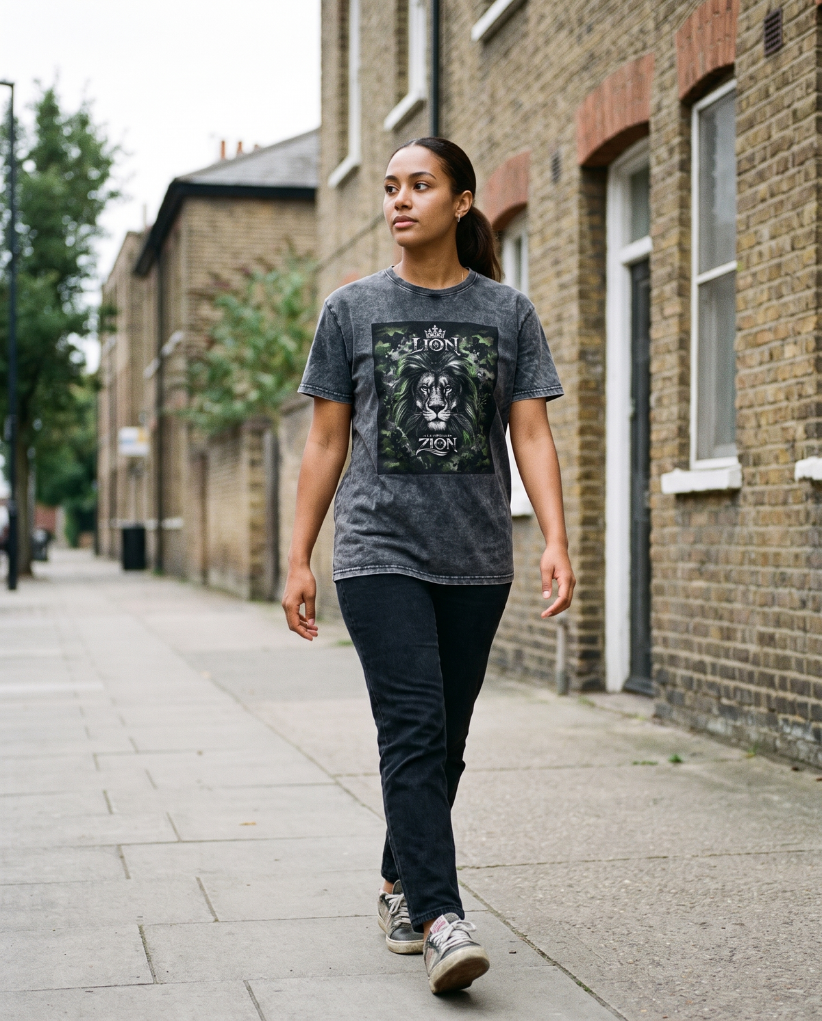 Woman wearing the Lion From Zion denim tee, street style