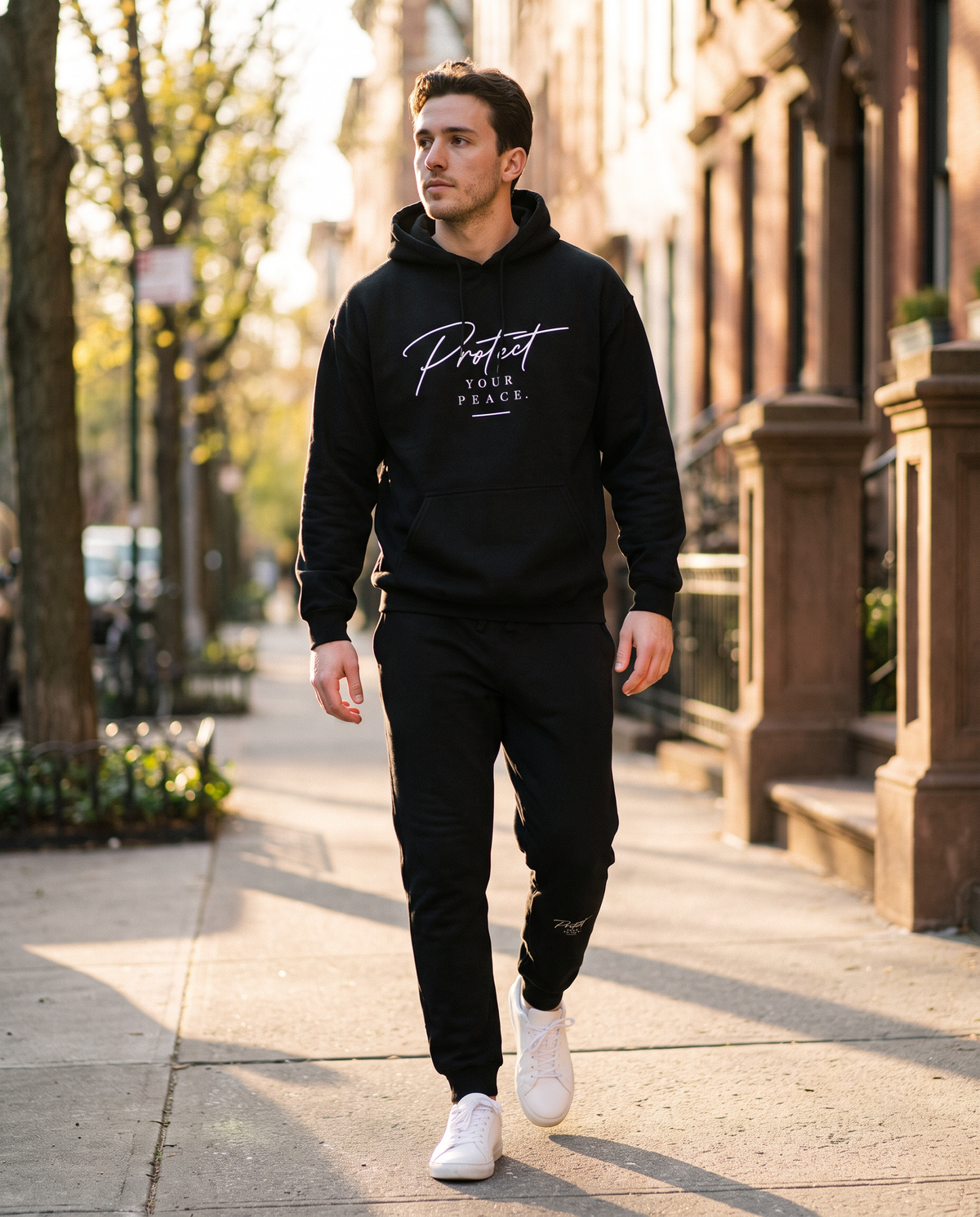 Protect Hoodie and matching fleece sweatpants worn walking on a city street