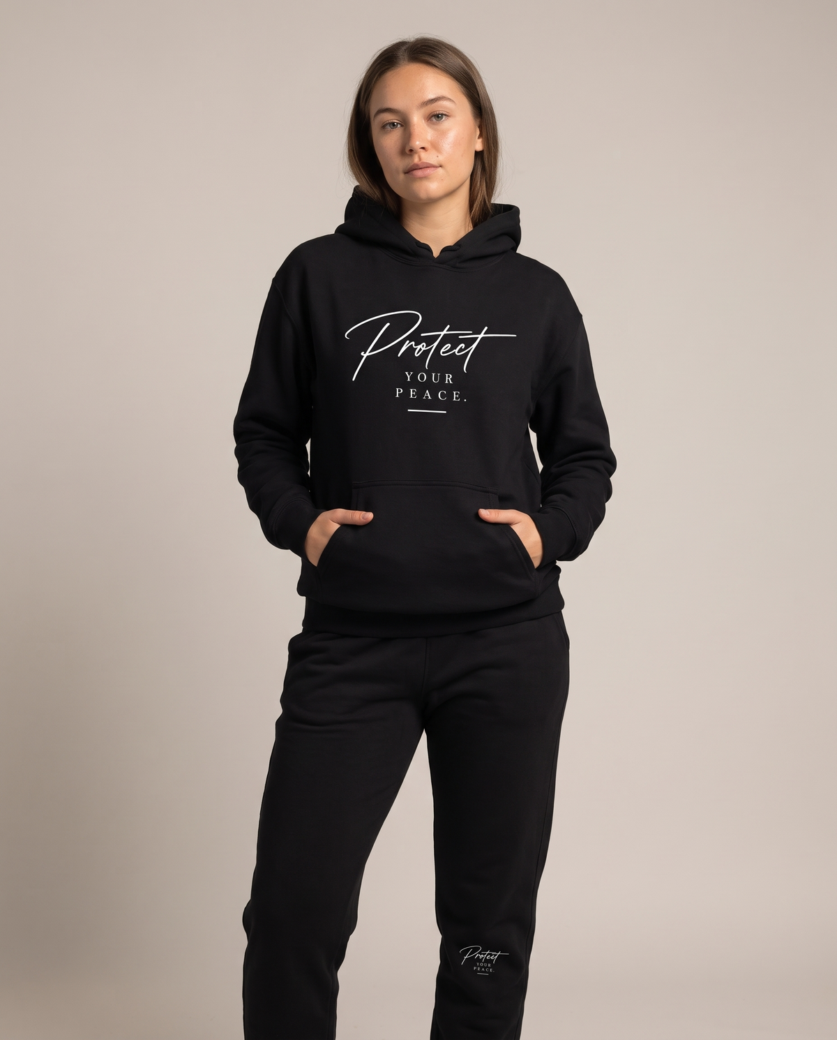 Protect Your Peace fleece sweatpants worn with the matching Protect Hoodie, studio front view